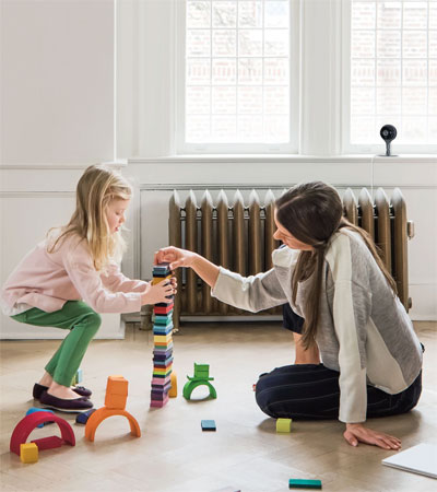  A girl and his mother playing with building blocks   